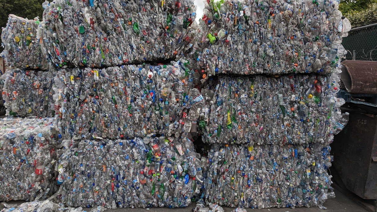 Compacted bales of post-consumer PET bottles